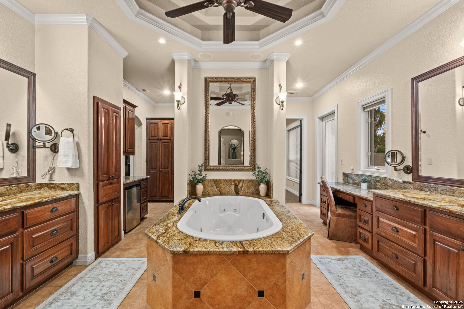 208 Cascade Caverns Road Boerne, TX 78015 - Photo 61 of 74 a bathroom with a granite countertop sink a mirror a vanity and shower