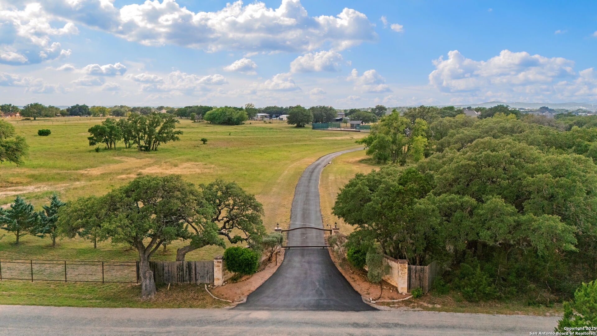 208 Cascade Caverns Road Boerne, TX 78015 - Photo 66 of 74 a view of a lake with a big yard and potted plants