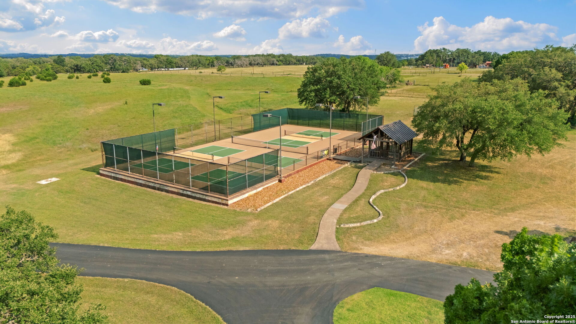 208 Cascade Caverns Road Boerne, TX 78015 - Photo 67 of 74 a view of a swimming pool with an ocean view