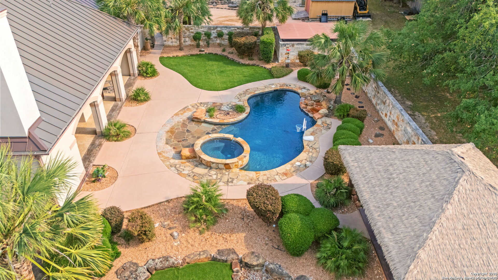 208 Cascade Caverns Road Boerne, TX 78015 - Photo 72 of 74 an aerial view of a house with swimming pool and garden
