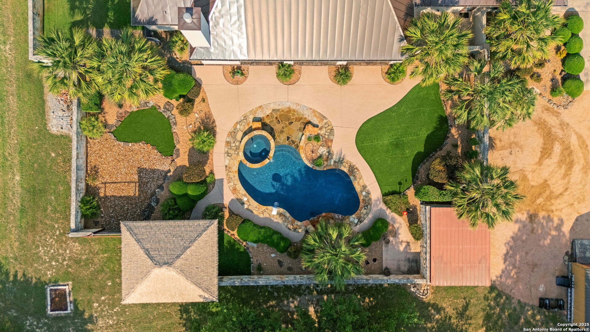 208 Cascade Caverns Road Boerne, TX 78015 - Photo 74 of 74 an aerial view of a house with a garden and a car park