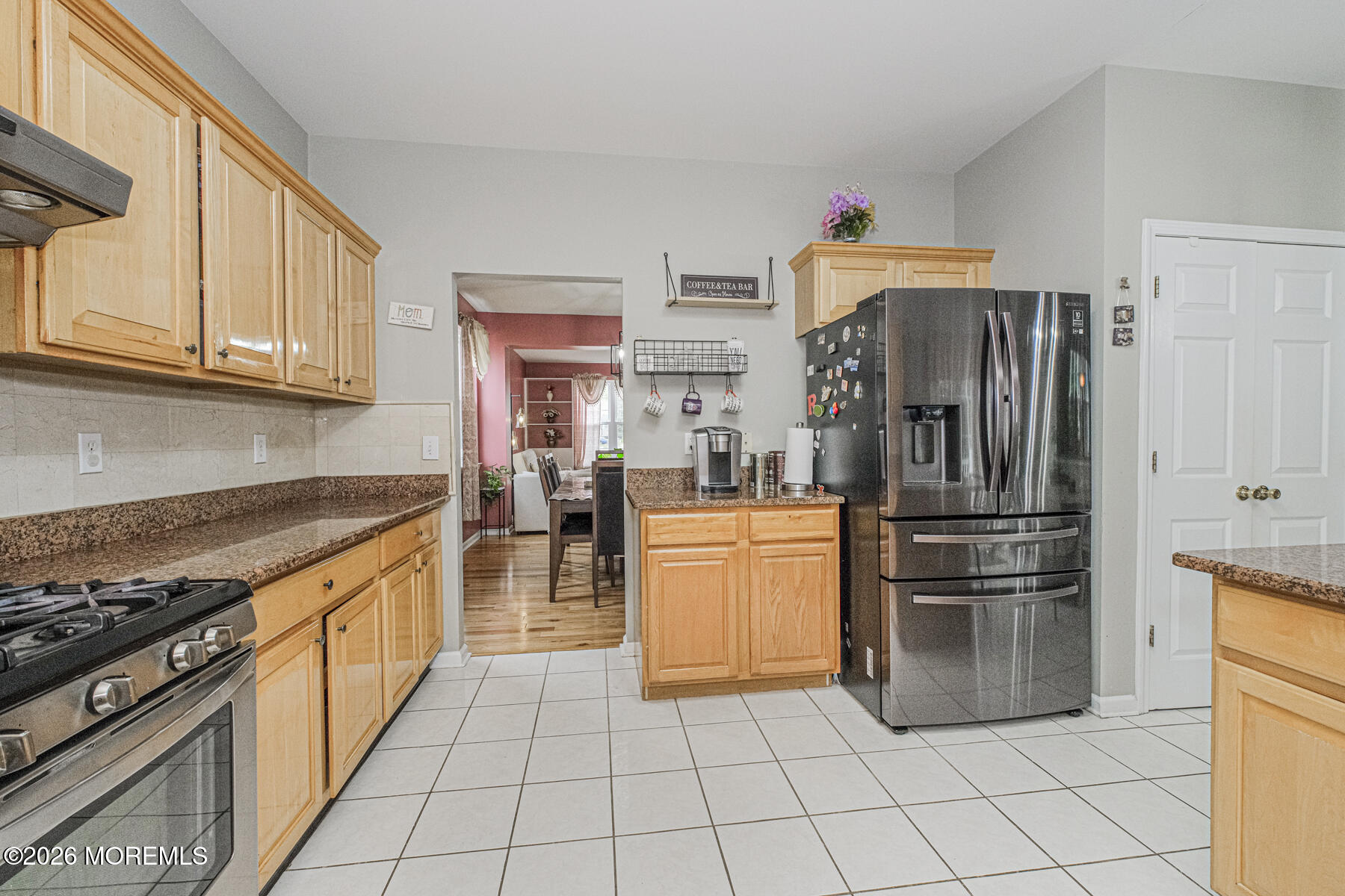 315 Wedgewood Road Morganville, NJ 07751 - Photo 16 of 37 a kitchen with stainless steel appliances granite countertop a refrigerator and a stove top oven