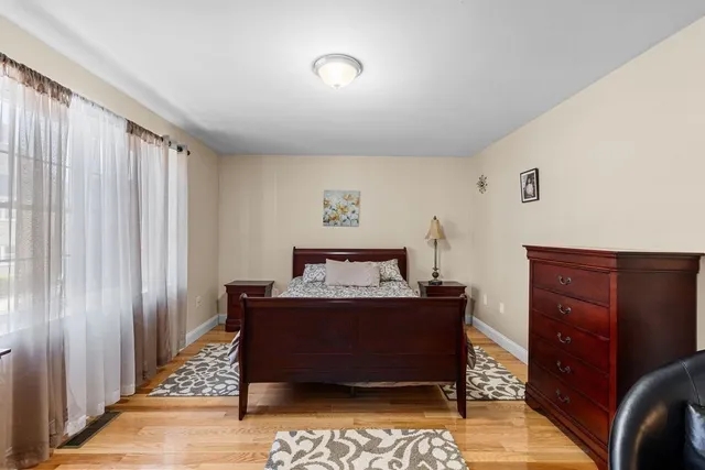 a bed room with a bed and a window