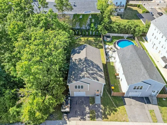 an aerial view of a house with outdoor space
