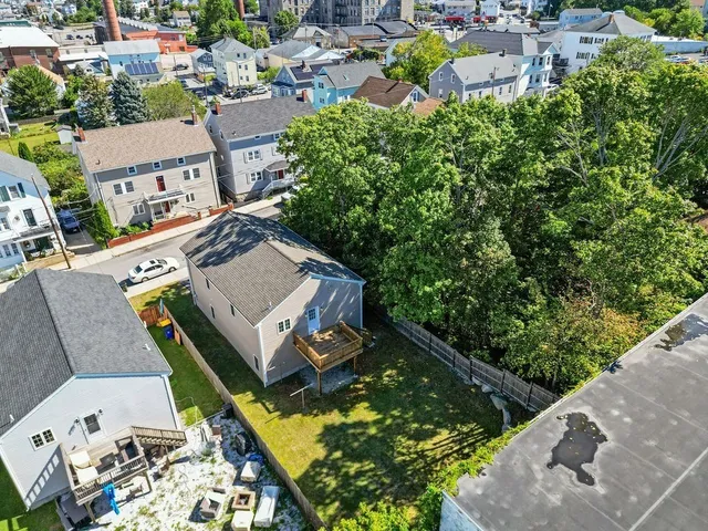 aerial view of a house with a garden and plants