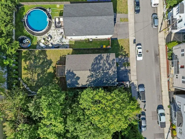 an aerial view of a house with garden space sitting space