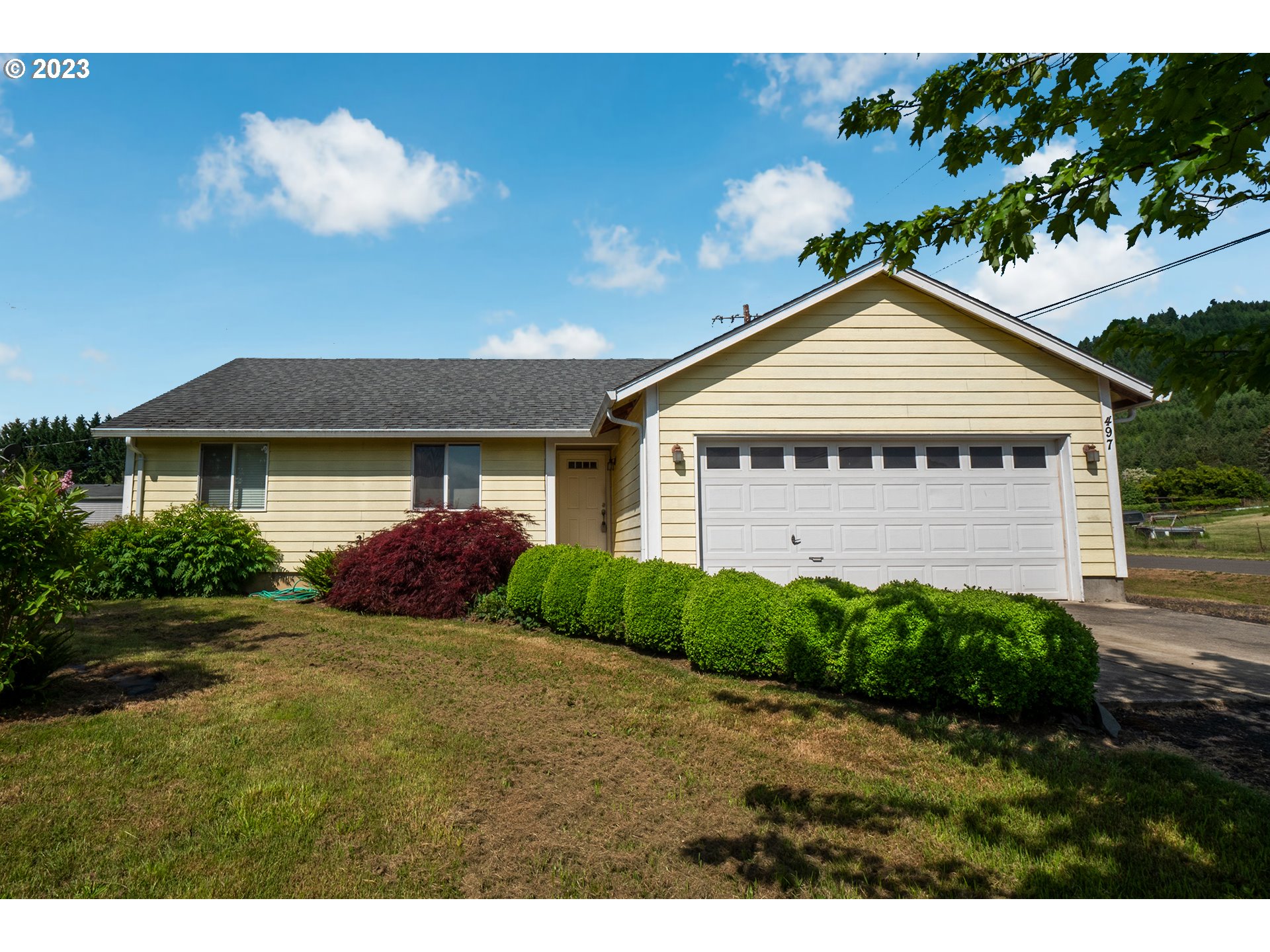 497 Maple Street Yoncalla, OR 97499 - Photo 1 of 24 a view of a house with a yard