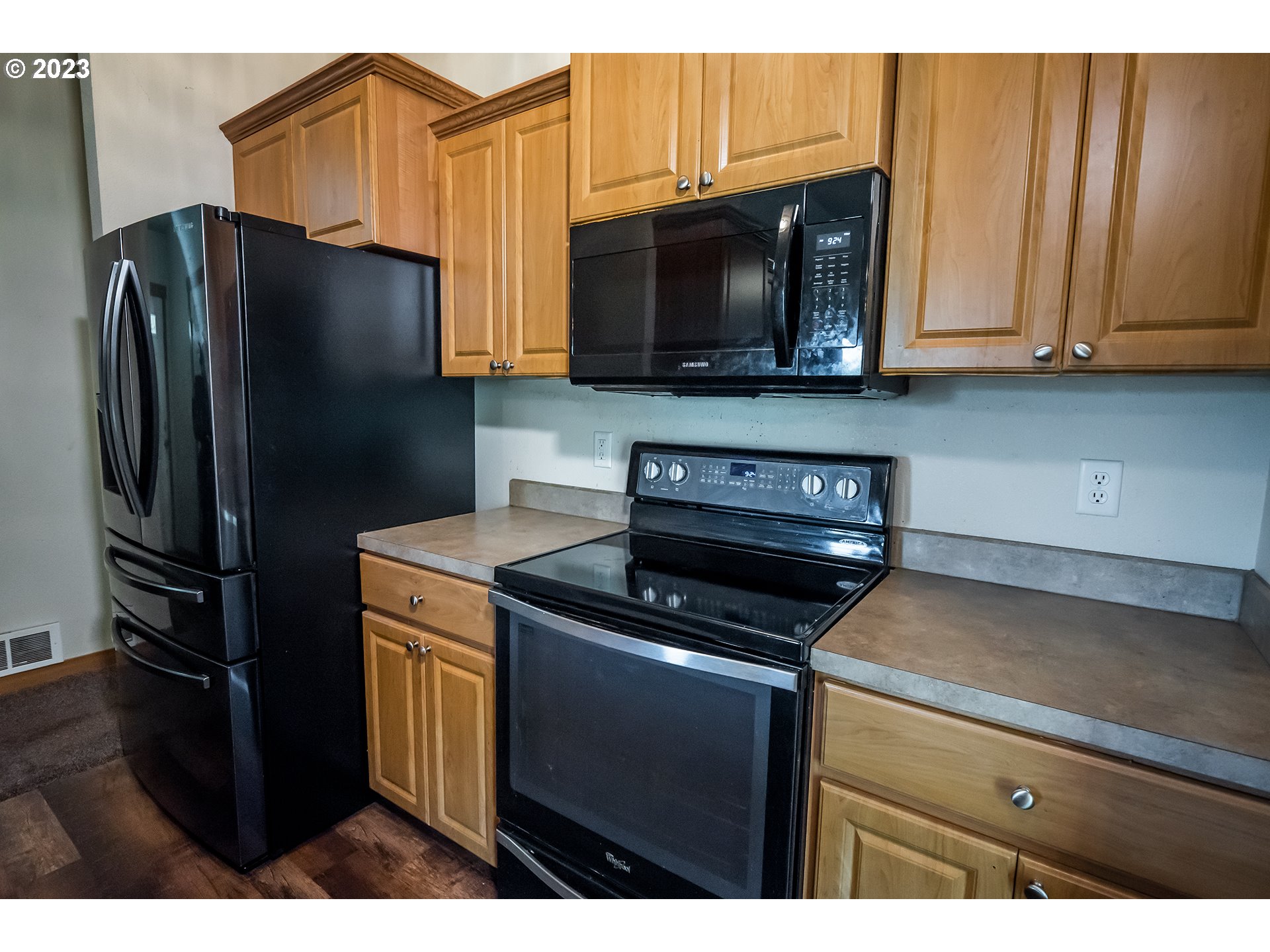 497 Maple Street Yoncalla, OR 97499 - Photo 13 of 24 a kitchen with stainless steel appliances granite countertop a refrigerator stove and microwave