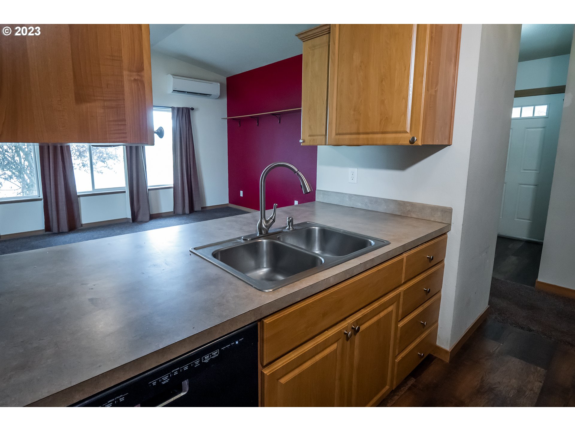 497 Maple Street Yoncalla, OR 97499 - Photo 10 of 24 a kitchen with stainless steel appliances a sink dishwasher and cabinets with wooden floor