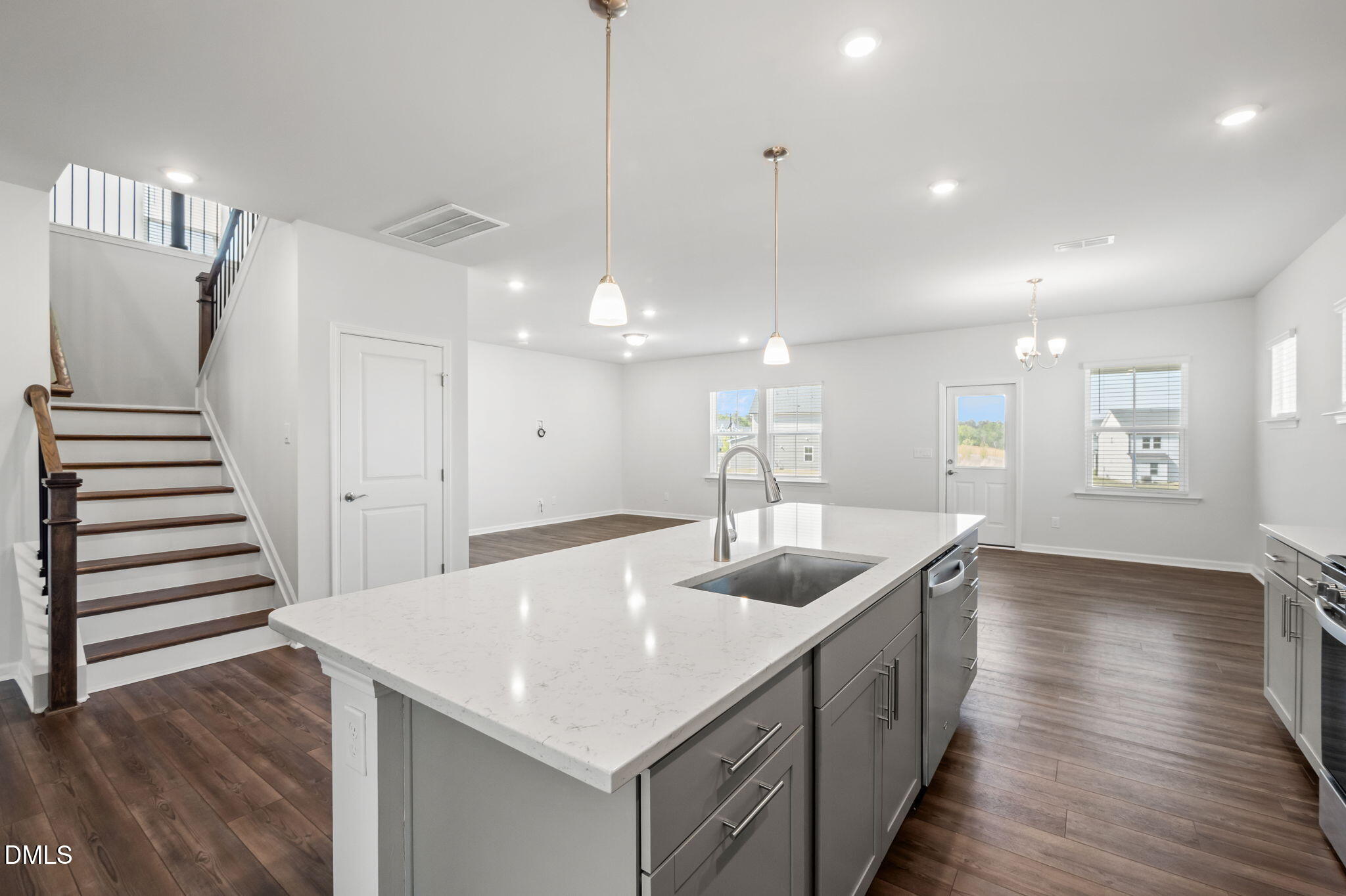 701 Mayfly Way Durham, NC 27703 - Photo 11 of 50 a kitchen with a sink and stove