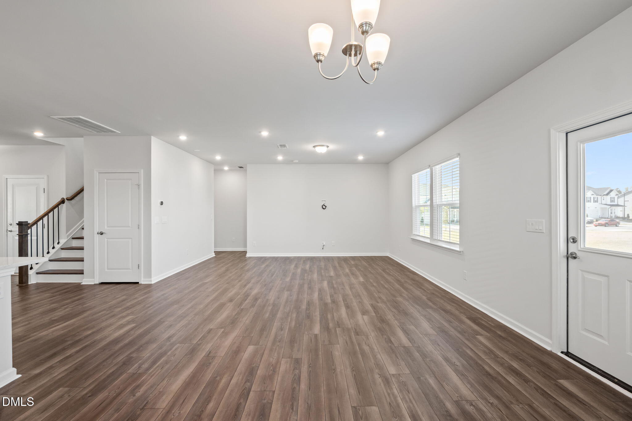 701 Mayfly Way Durham, NC 27703 - Photo 12 of 50 a view of empty room with wooden floor and fan