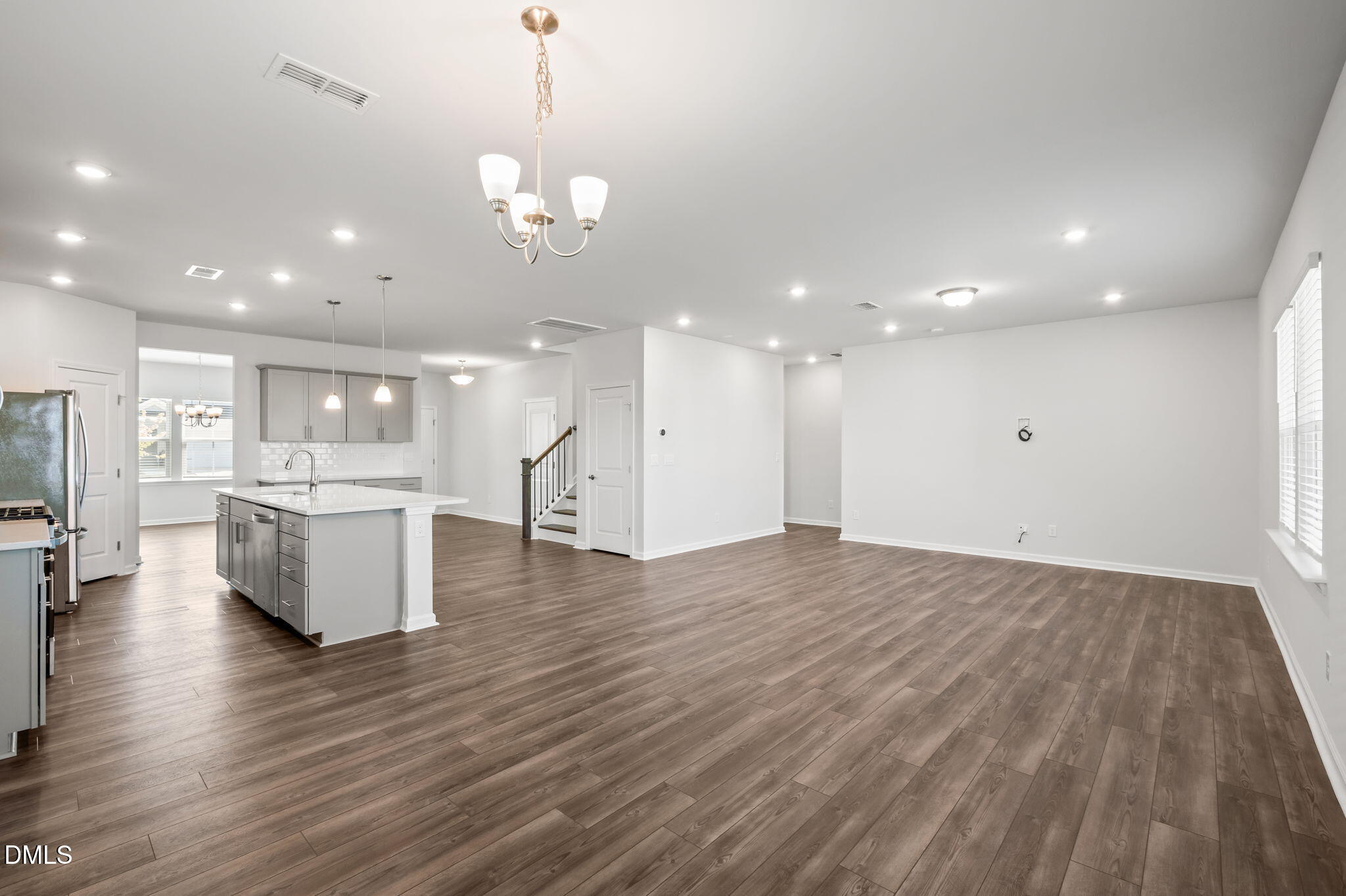 701 Mayfly Way Durham, NC 27703 - Photo 14 of 50 a view of a kitchen and living room with a hard wood floor