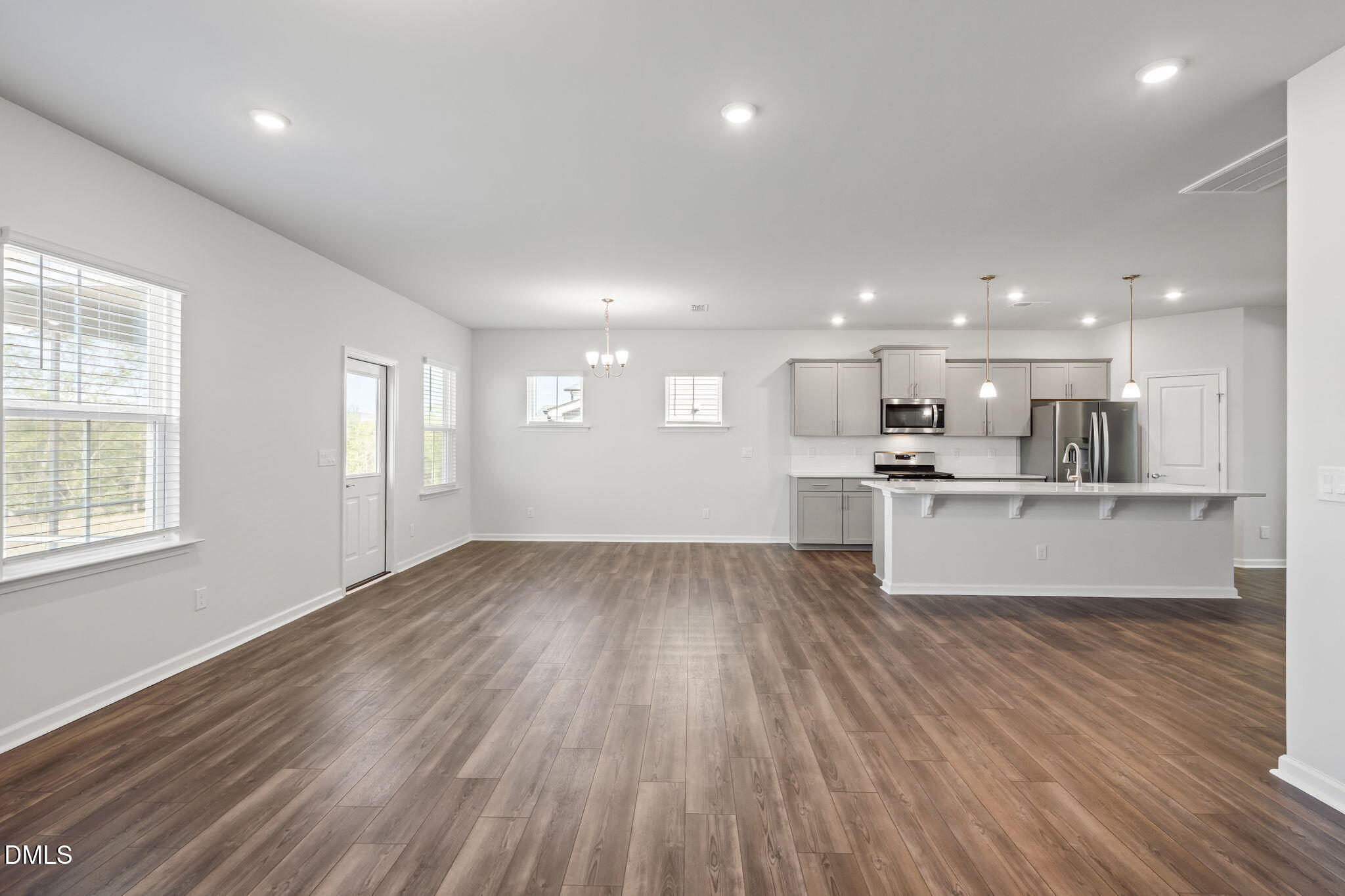 701 Mayfly Way Durham, NC 27703 - Photo 17 of 50 a view of kitchen with wooden floor and windows