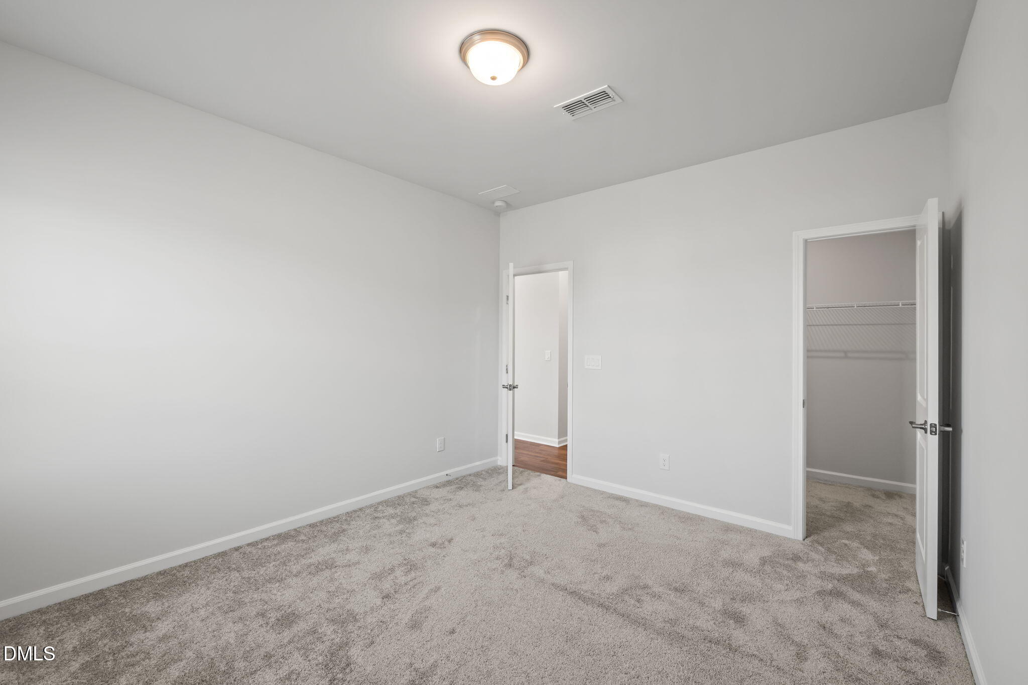 701 Mayfly Way Durham, NC 27703 - Photo 19 of 50 an empty room with an entryway