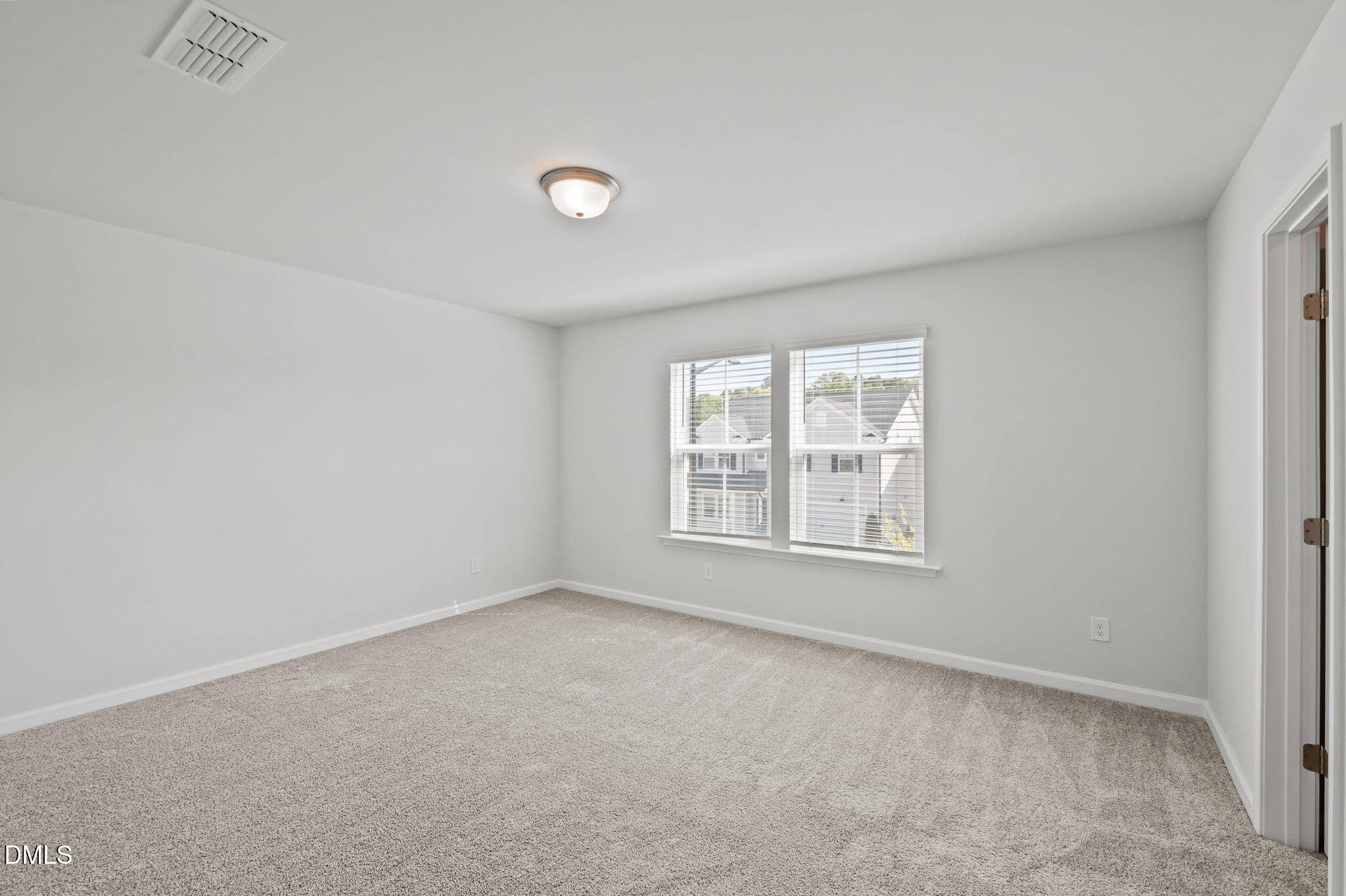 701 Mayfly Way Durham, NC 27703 - Photo 30 of 50 an empty room with a window