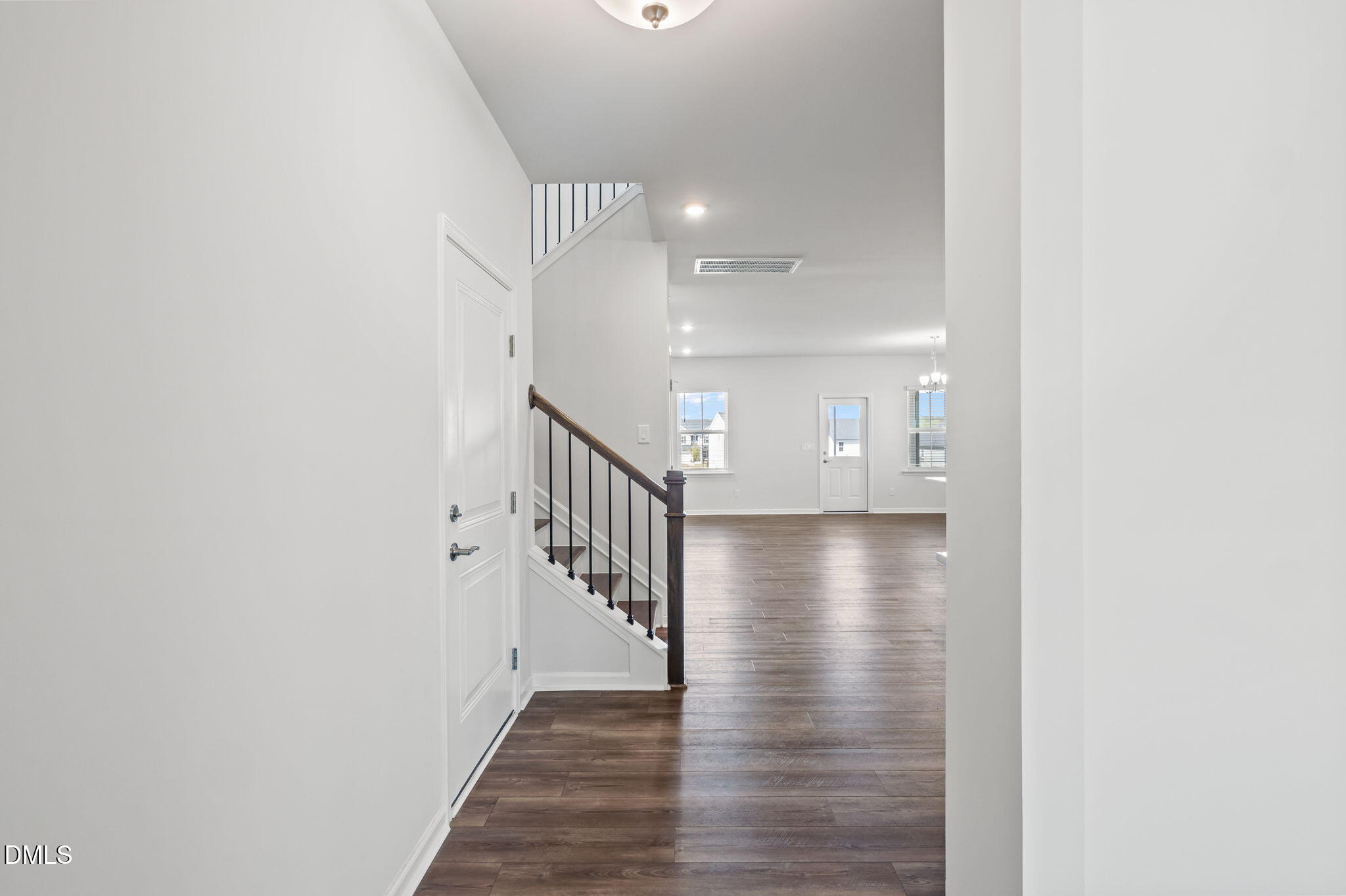 701 Mayfly Way Durham, NC 27703 - Photo 3 of 50 a view of a hallway with wooden floor and staircase