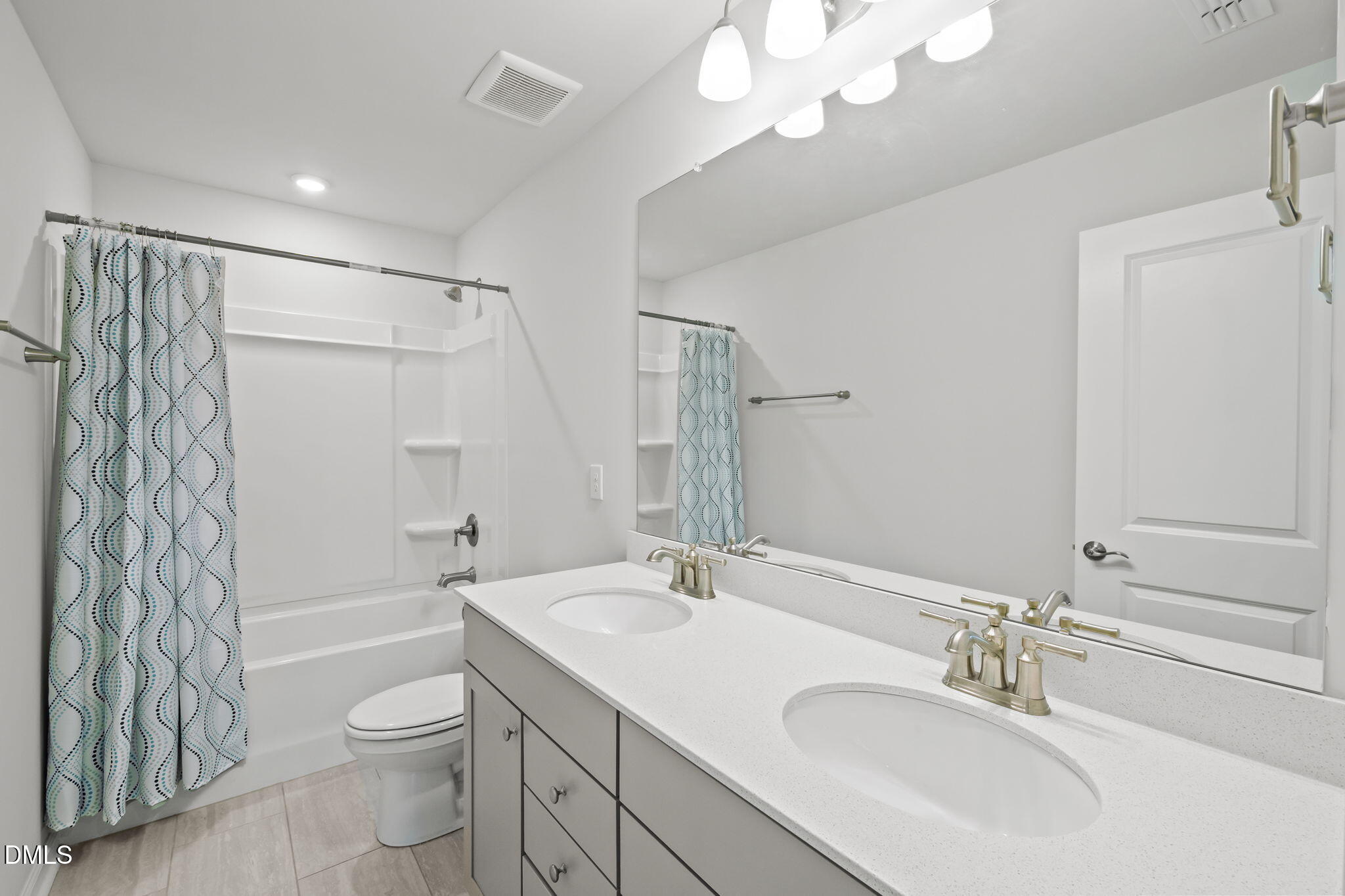 701 Mayfly Way Durham, NC 27703 - Photo 34 of 50 a bathroom with a sink a toilet and shower