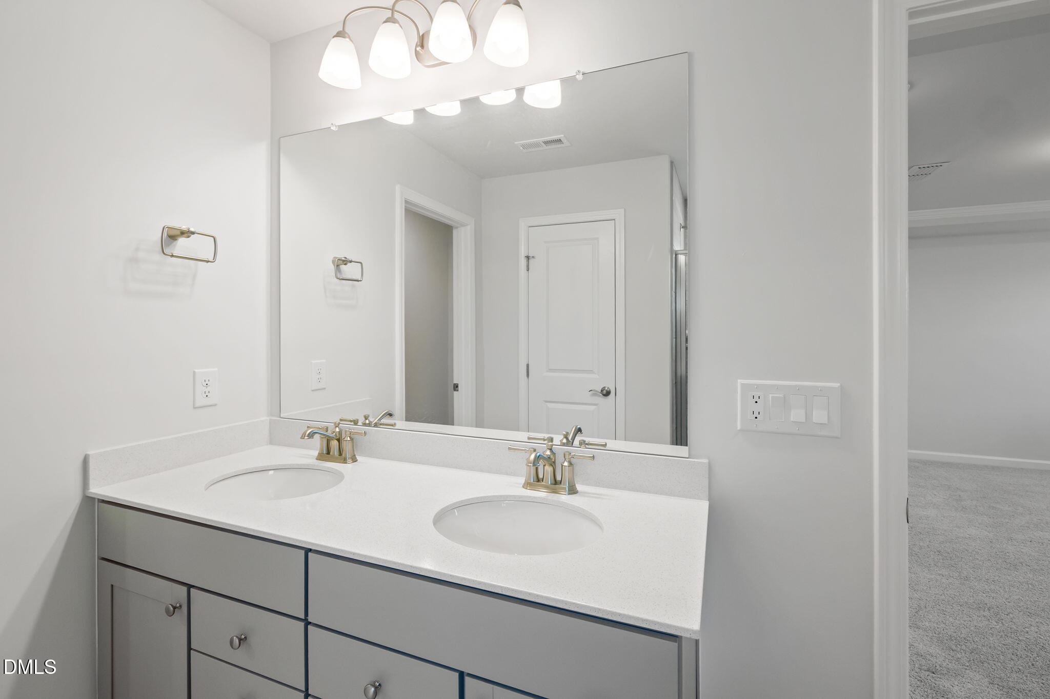 701 Mayfly Way Durham, NC 27703 - Photo 38 of 50 a bathroom with a sink and a mirror
