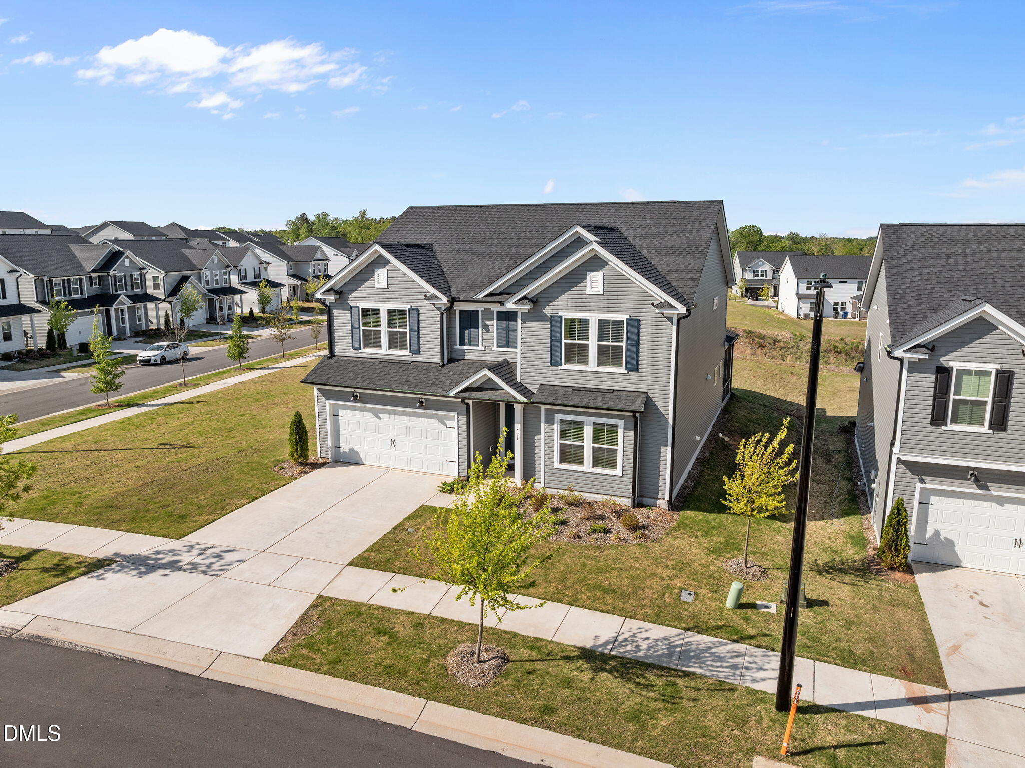 701 Mayfly Way Durham, NC 27703 - Photo 43 of 50 a front view of a house with garden