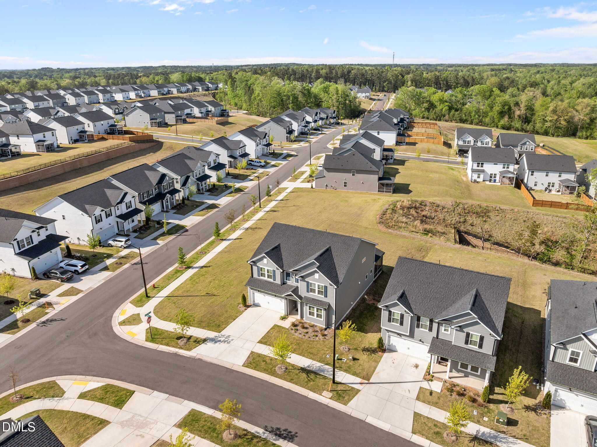701 Mayfly Way Durham, NC 27703 - Photo 47 of 50 an aerial view of residential houses with outdoor space
