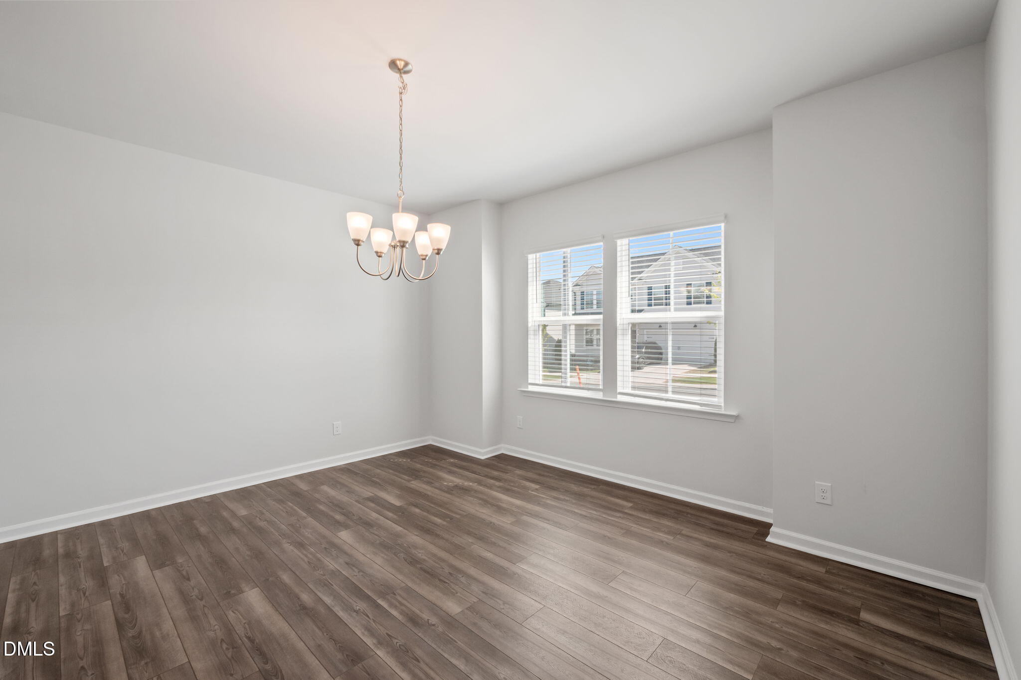 701 Mayfly Way Durham, NC 27703 - Photo 6 of 50 a view of a room with wooden floor chandelier and window