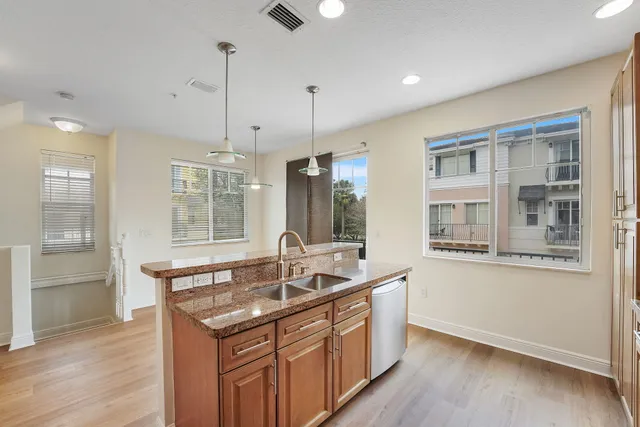 a view of kitchen with furniture and wooden floor