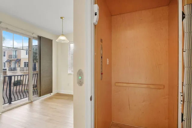 a kitchen with stainless steel appliances granite countertop a refrigerator a sink and a stove