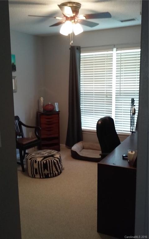 8445 Angwin Place Charlotte, NC 28262 - Photo 16 of 20 a view of entryway and hall with wooden floor