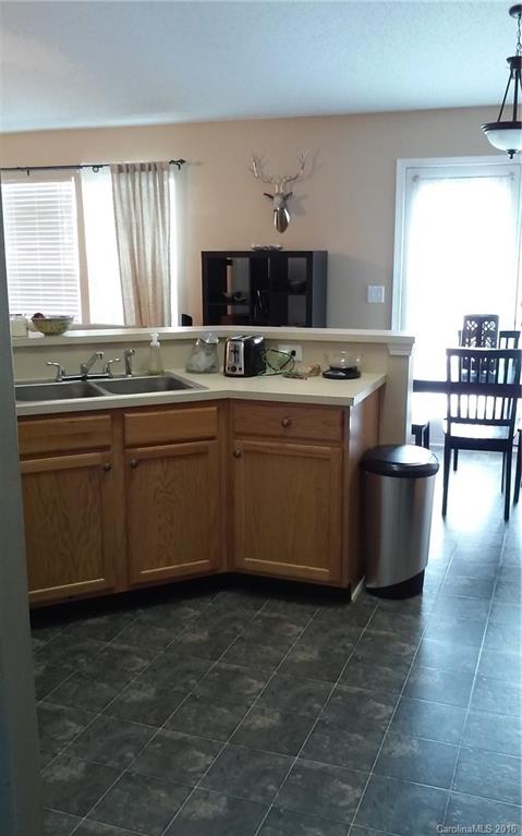 8445 Angwin Place Charlotte, NC 28262 - Photo 7 of 20 a bathroom with a bathtub
