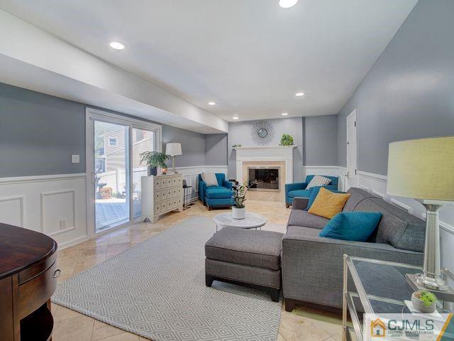 33 Thomas Road East Brunswick, NJ 08816 - Photo 12 of 28 a living room with furniture and a fireplace