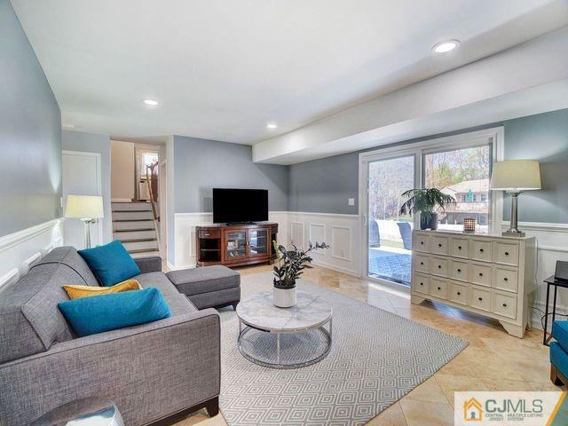 33 Thomas Road East Brunswick, NJ 08816 - Photo 13 of 28 a living room with furniture and a flat screen tv