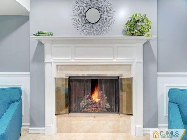 33 Thomas Road East Brunswick, NJ 08816 - Photo 14 of 28 a view of a fireplace with wooden floor