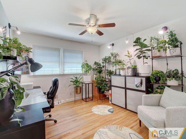 33 Thomas Road East Brunswick, NJ 08816 - Photo 19 of 28 a living room with furniture potted plant and a chandelier