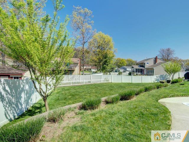33 Thomas Road East Brunswick, NJ 08816 - Photo 23 of 28 a view of a garden with a building in the background