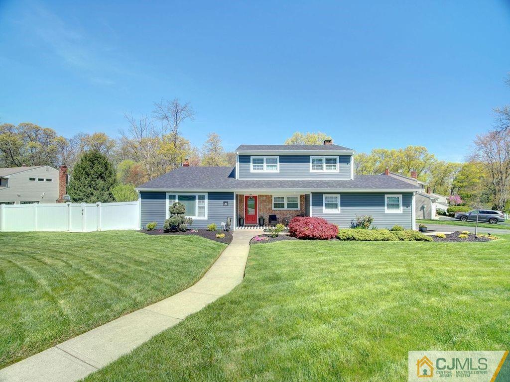 33 Thomas Road East Brunswick, NJ 08816 - Photo 26 of 28 a front view of a house with a yard