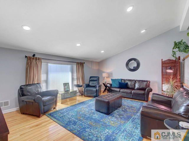 33 Thomas Road East Brunswick, NJ 08816 - Photo 4 of 28 a living room with furniture