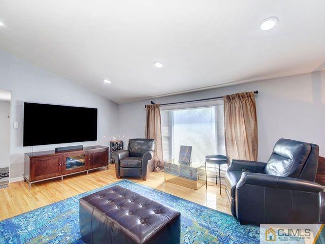 33 Thomas Road East Brunswick, NJ 08816 - Photo 5 of 28 a living room with furniture and a flat screen tv