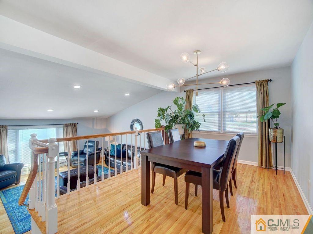 33 Thomas Road East Brunswick, NJ 08816 - Photo 7 of 28 a view of a dining room with furniture and wooden floor