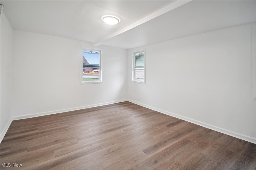 8796 West Ridgewood Drive Cleveland, OH 44130 - Photo 21 of 38 Empty room with hardwood / wood-style floors