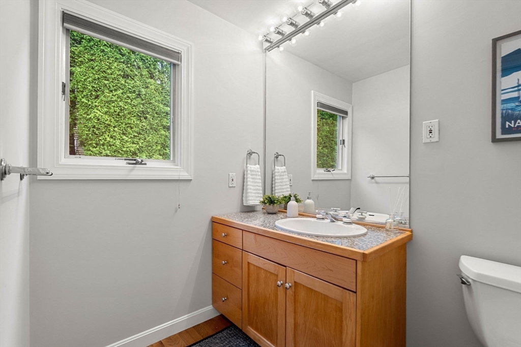 53 Gerald Road Marblehead, MA 01945 - Photo 19 of 42 a bathroom with a sink a vanity and a toilet