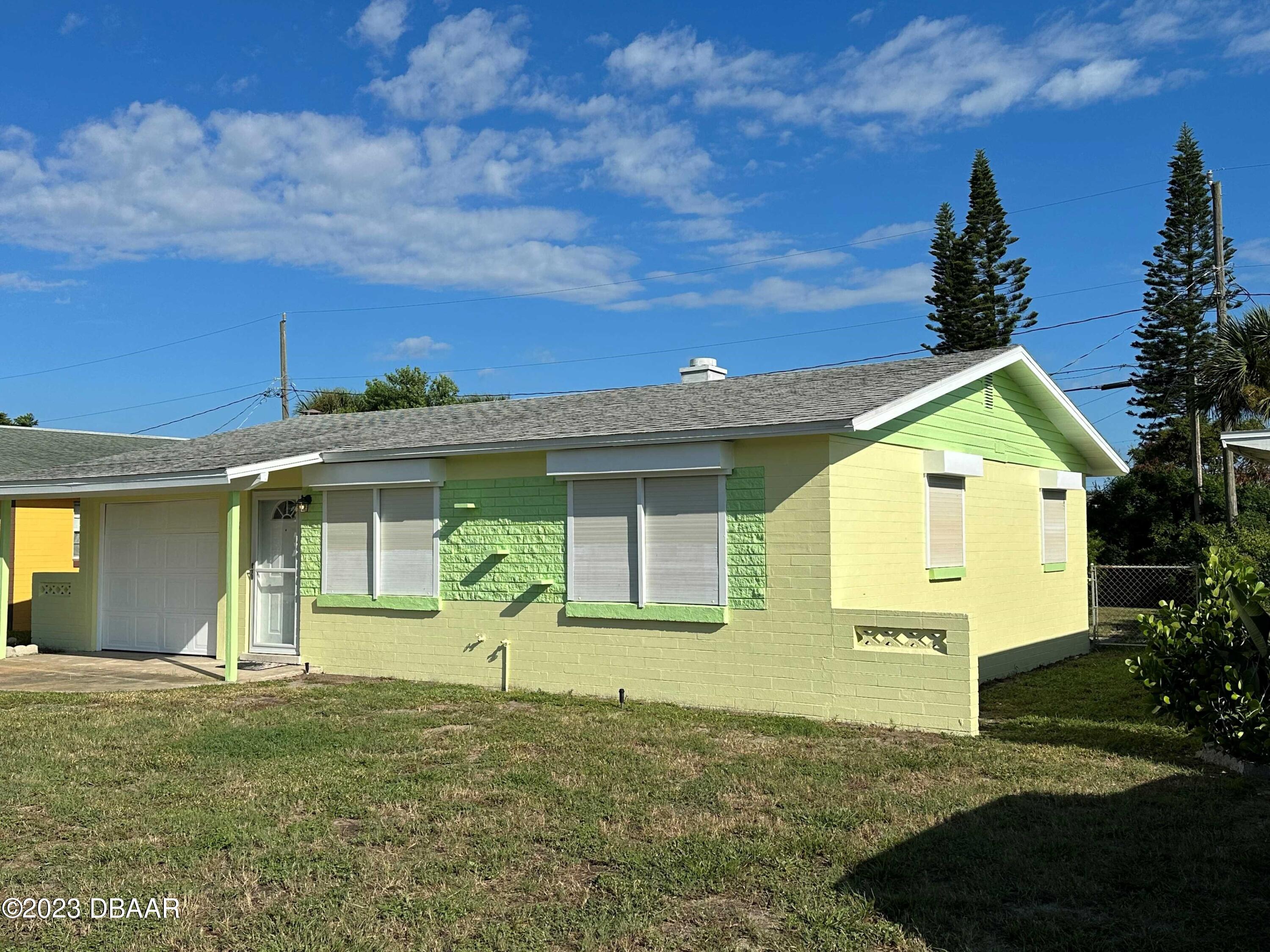 38 Carol Road Ormond Beach, FL 32176 - Photo 16 of 16 a front view of a house with garden
