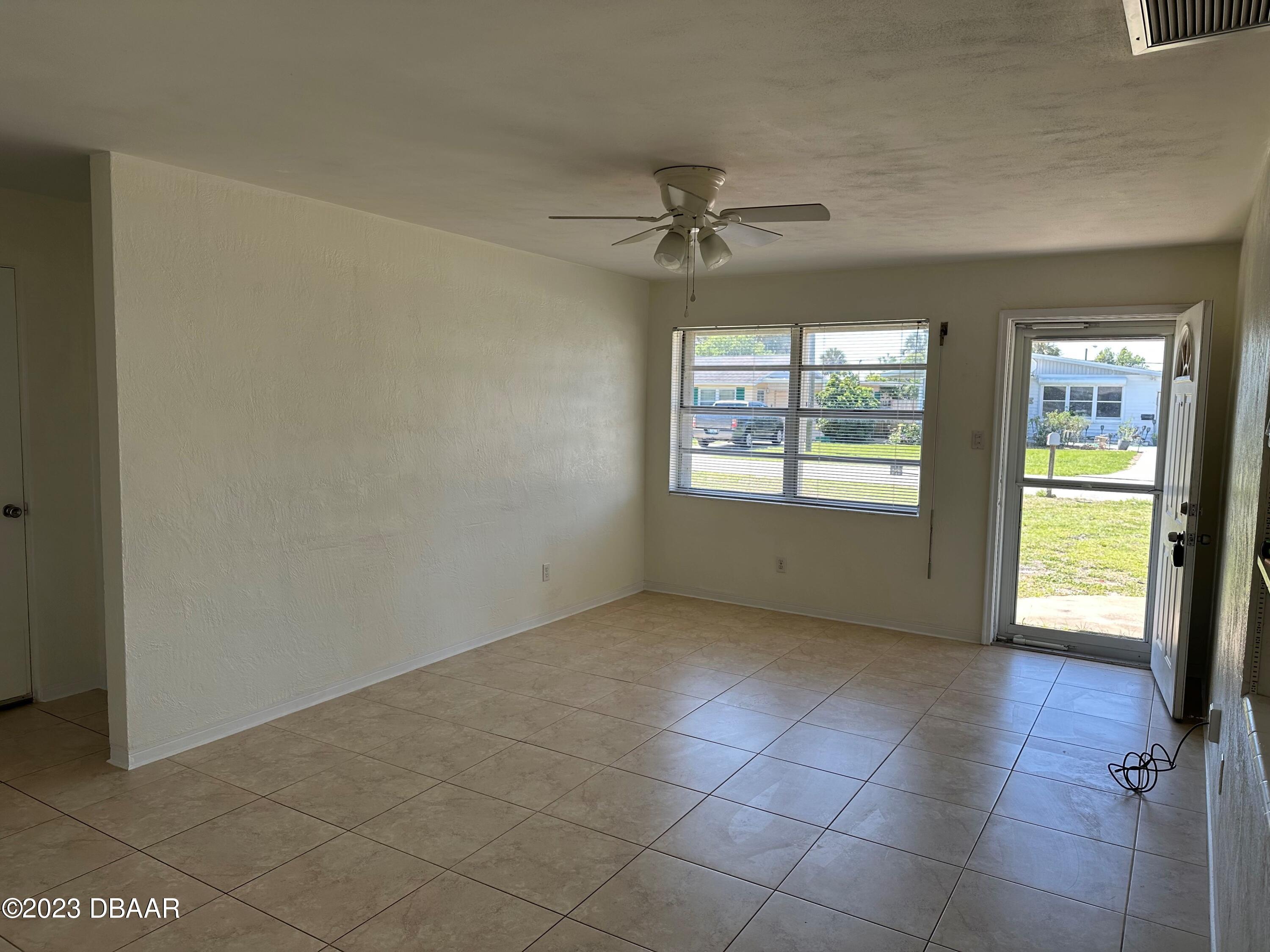 38 Carol Road Ormond Beach, FL 32176 - Photo 2 of 16 a view of an empty room and window