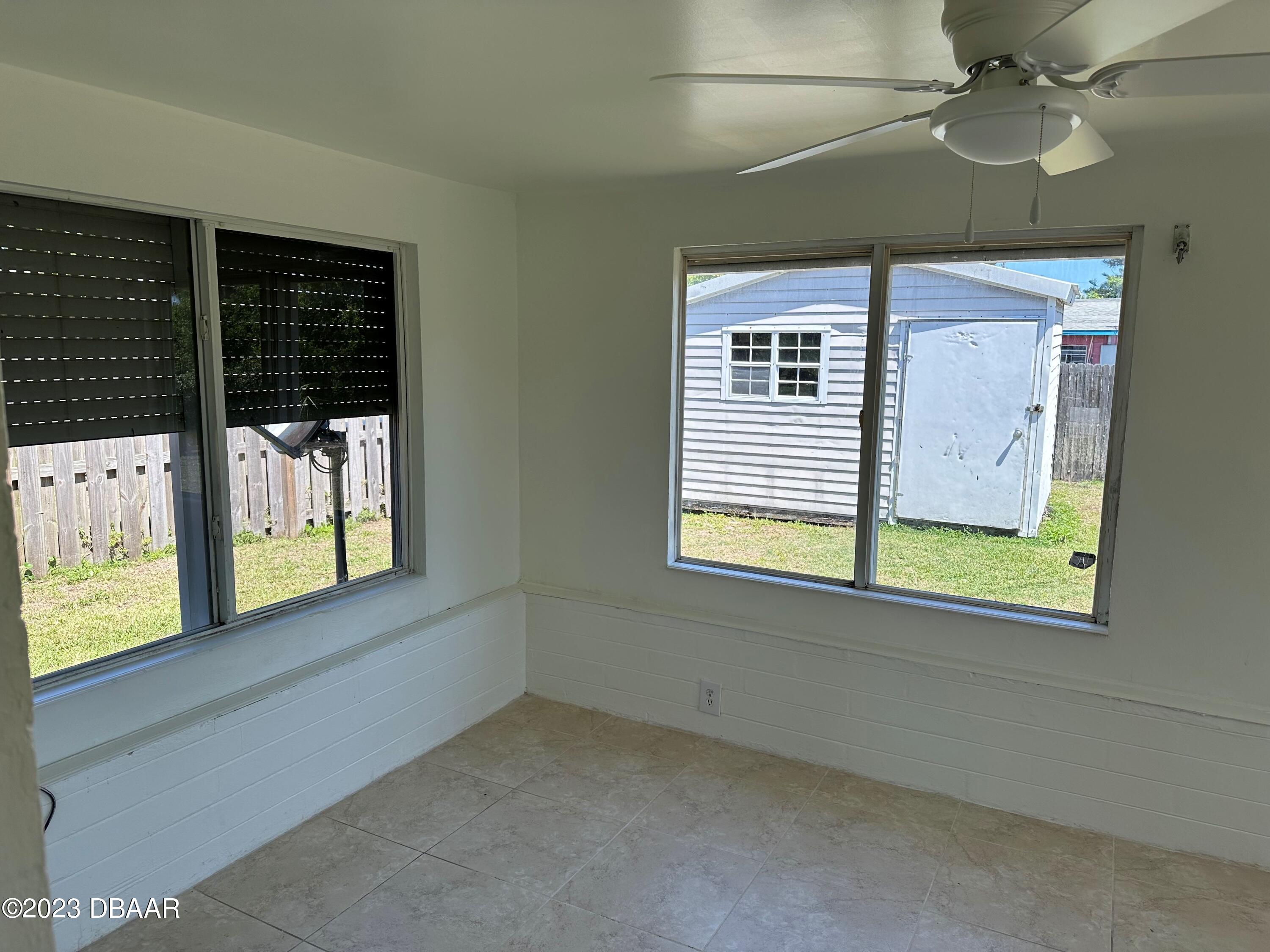 38 Carol Road Ormond Beach, FL 32176 - Photo 7 of 16 a view of an empty room with a window