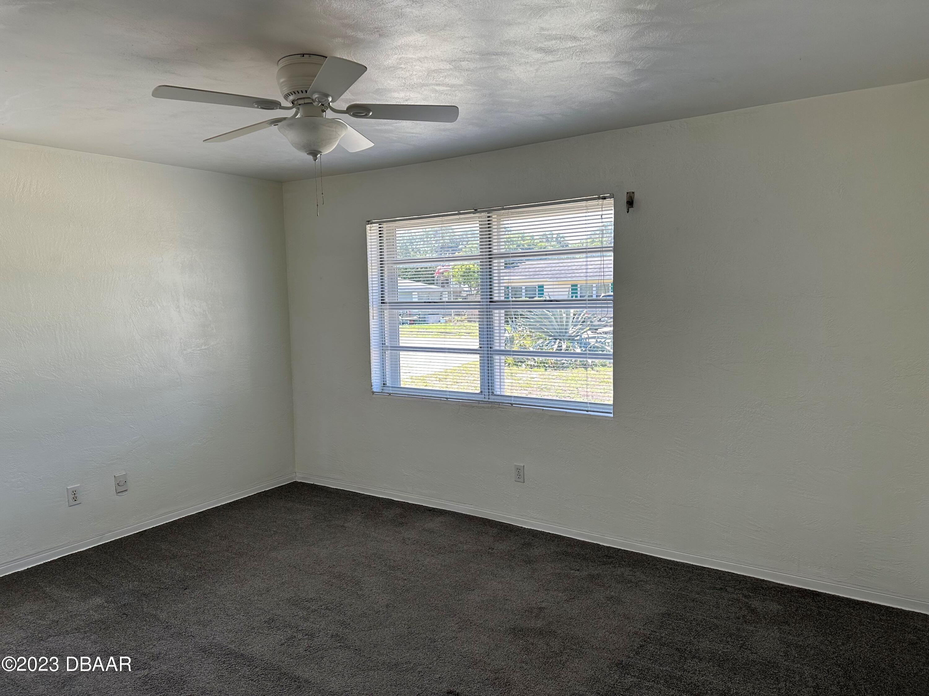 38 Carol Road Ormond Beach, FL 32176 - Photo 8 of 16 an empty room with a window
