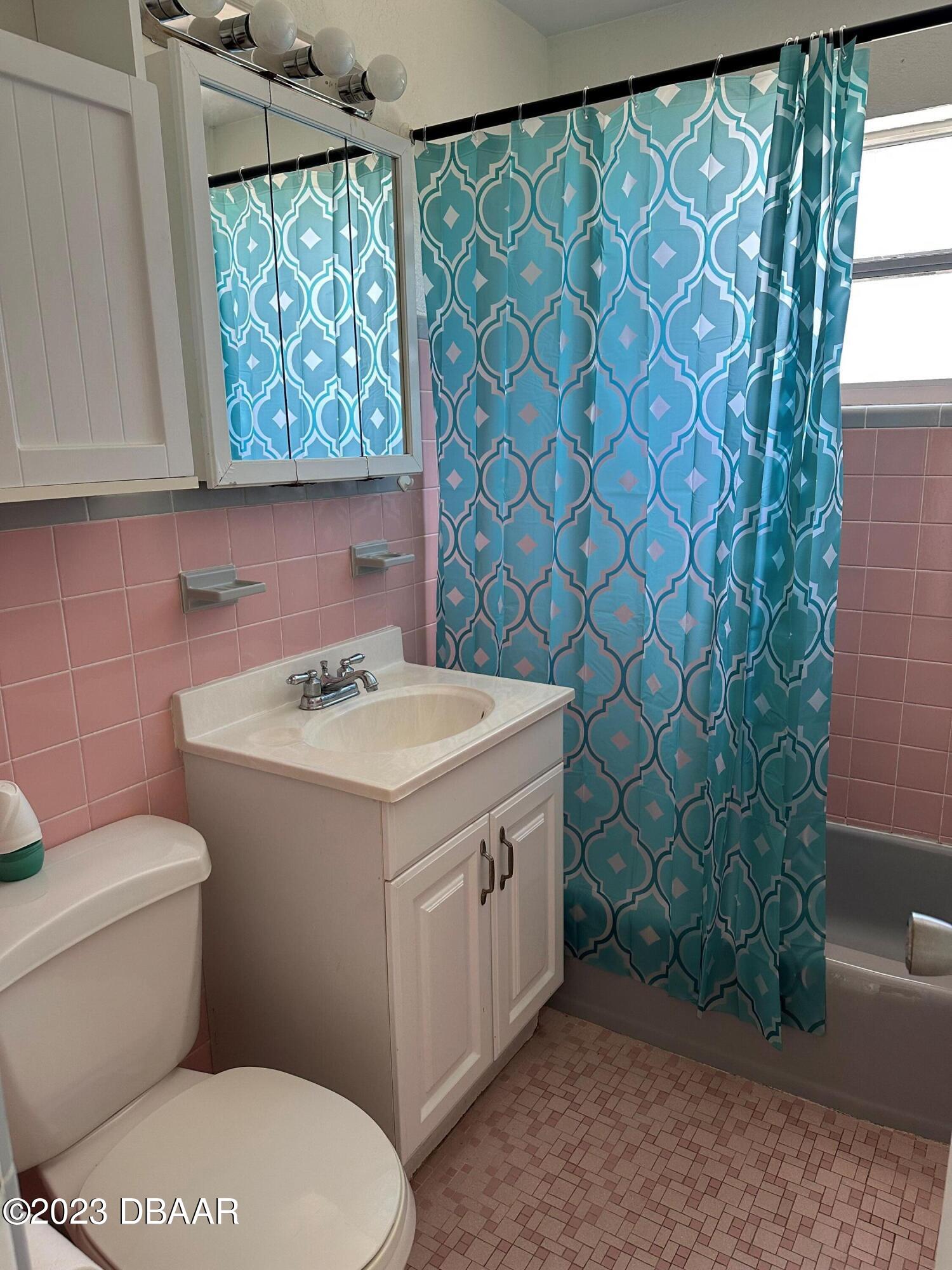 38 Carol Road Ormond Beach, FL 32176 - Photo 9 of 16 a bathroom with a sink toilet and window