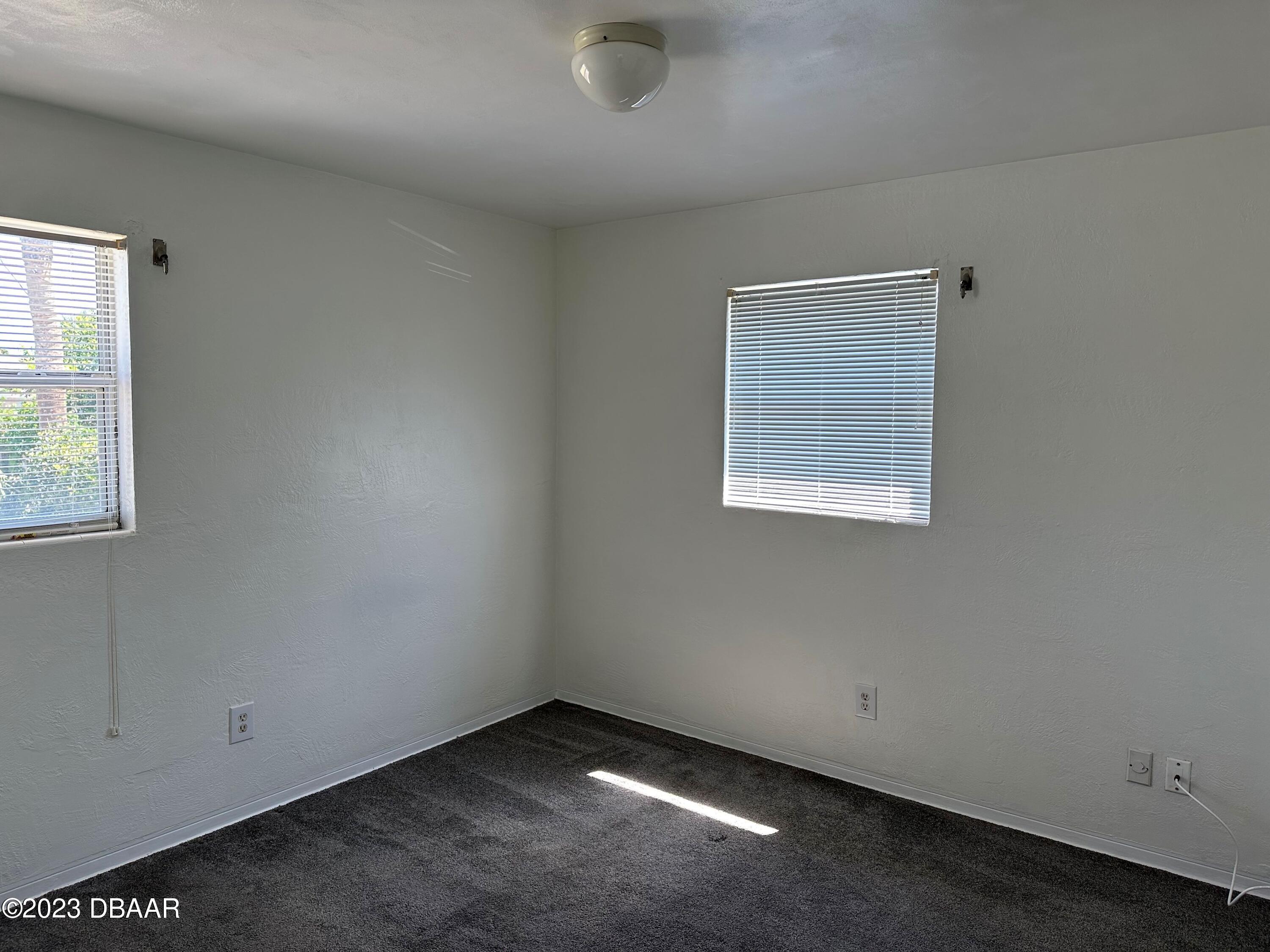 38 Carol Road Ormond Beach, FL 32176 - Photo 10 of 16 an empty room with a window