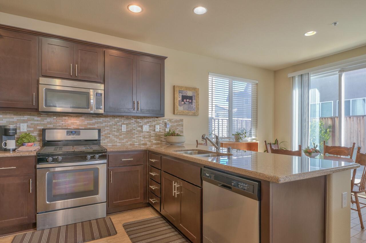 1805 Monte Bella Boulevard Salinas, CA 93905 - Photo 13 of 32 a kitchen with a sink stove and microwave