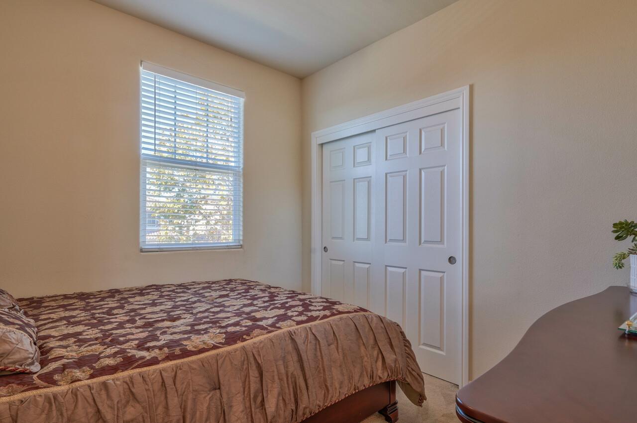 1805 Monte Bella Boulevard Salinas, CA 93905 - Photo 31 of 32 a bedroom with a bed and a window