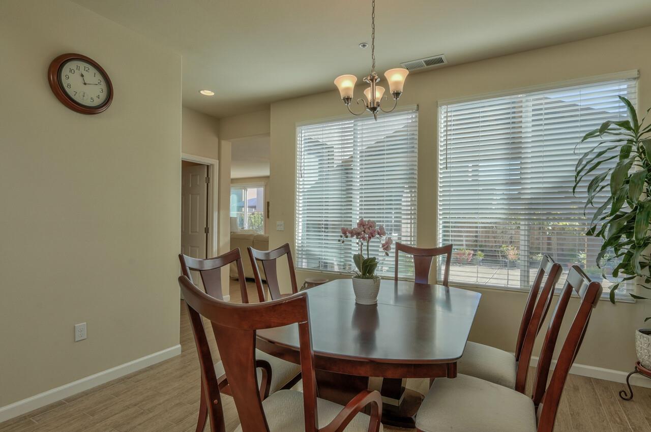 1805 Monte Bella Boulevard Salinas, CA 93905 - Photo 5 of 32 a view of a dining room with furniture window and wooden floor