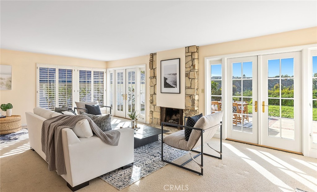 215 Via Montego San Clemente, CA 92672 - Photo 14 of 69 a living room with furniture and a floor to ceiling window